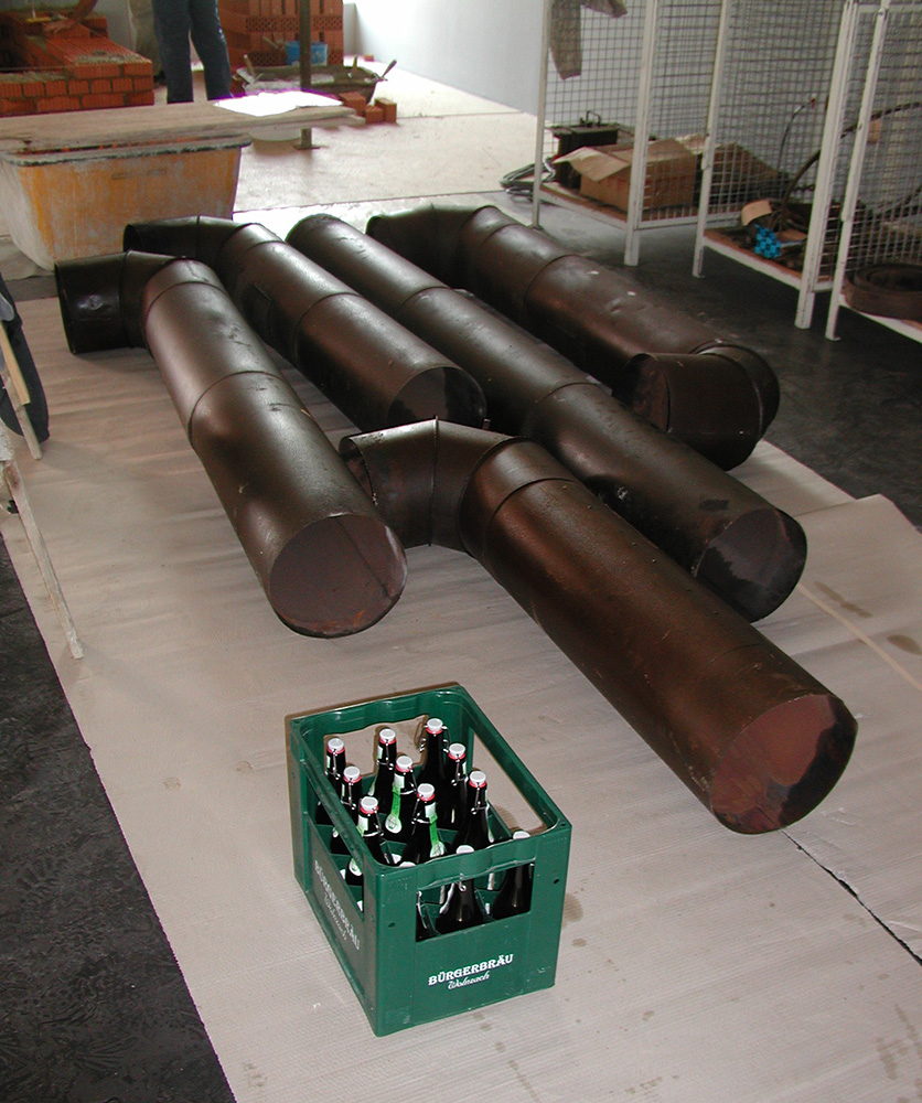 The heating pipes before being installed in the museum kiln. Still available at the time: beer from Bürgerbräu Wolnzach.
