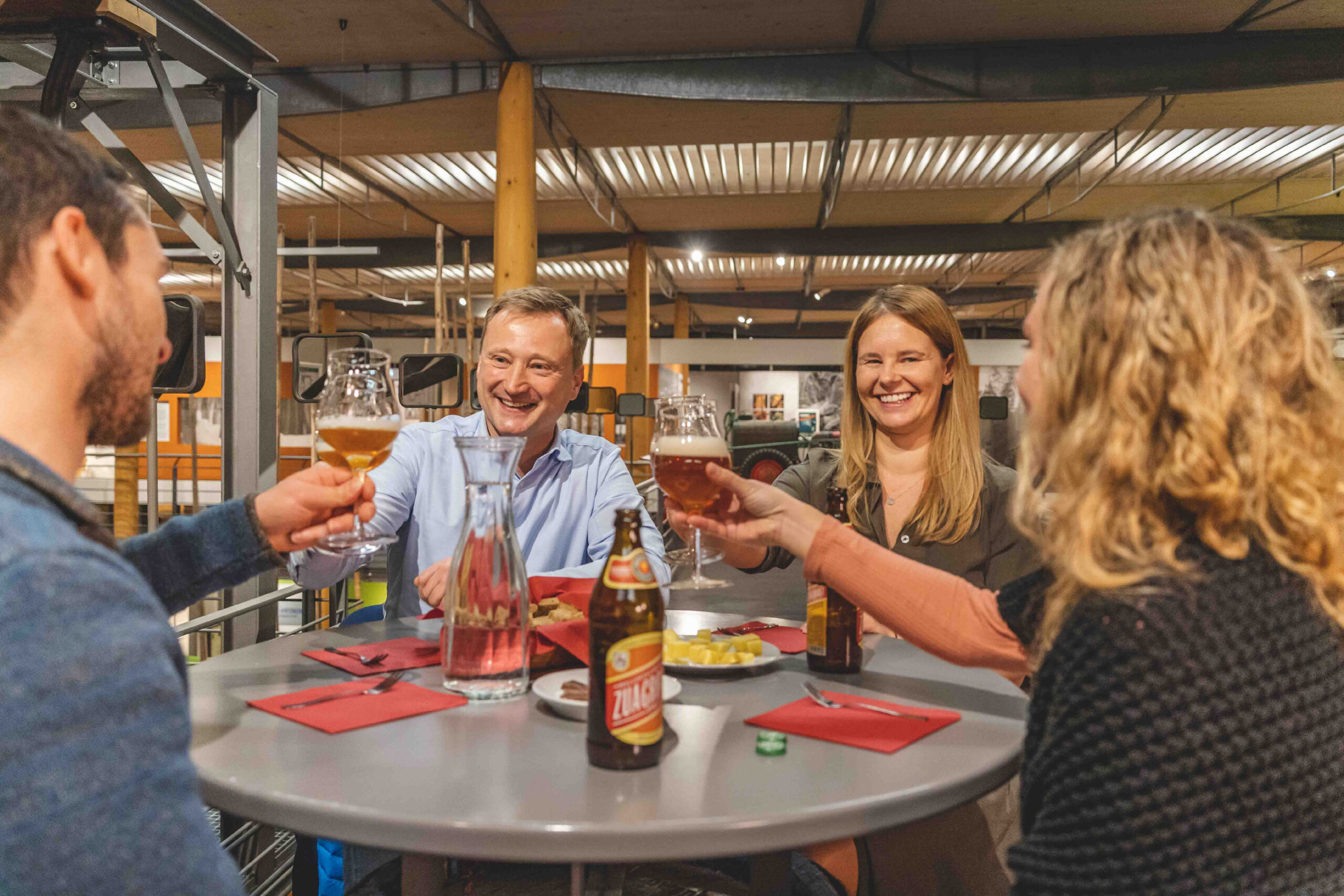 Guests at a Wolnzach beer tasting toast each other