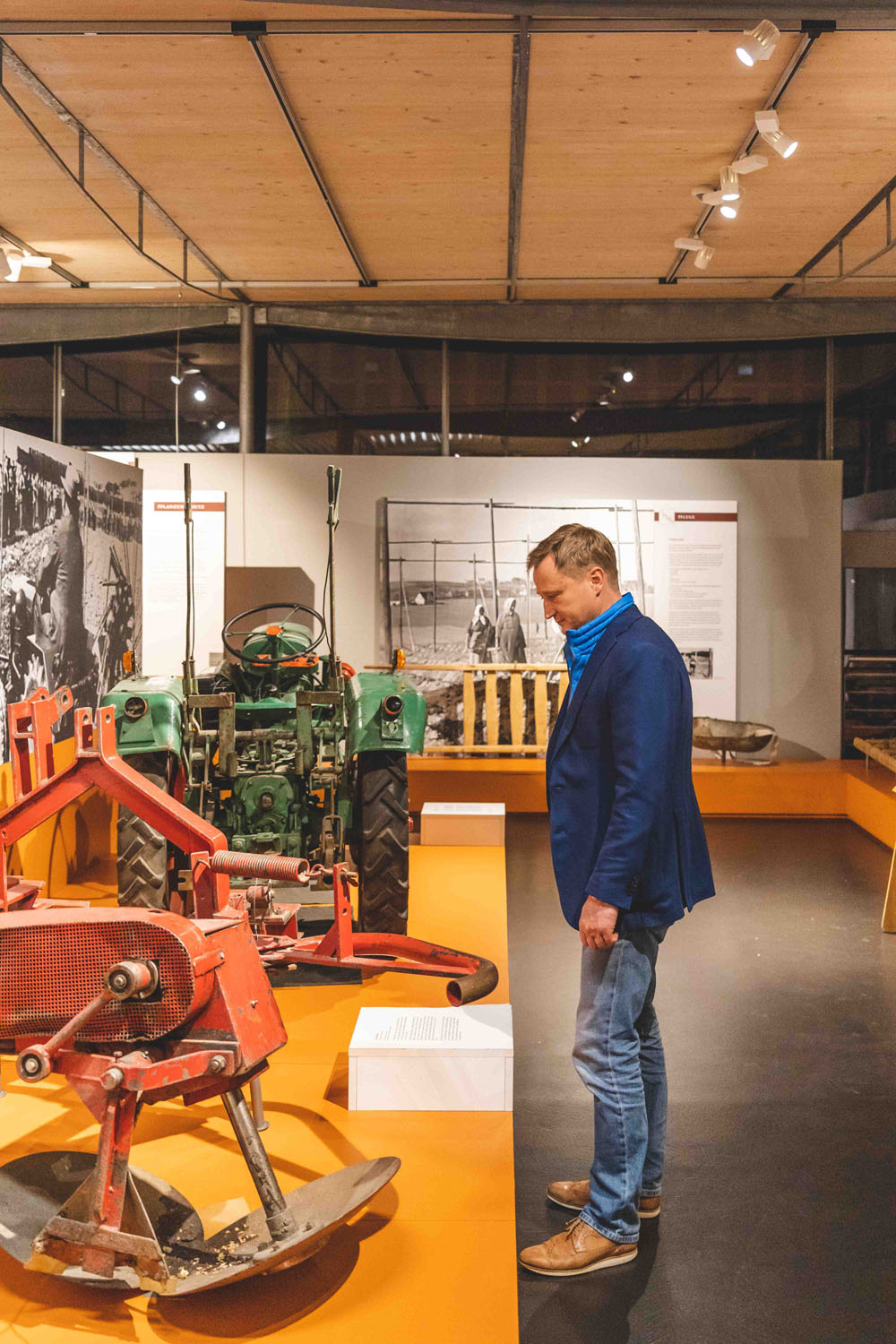 A visitor informs himself about devices for soil preparation